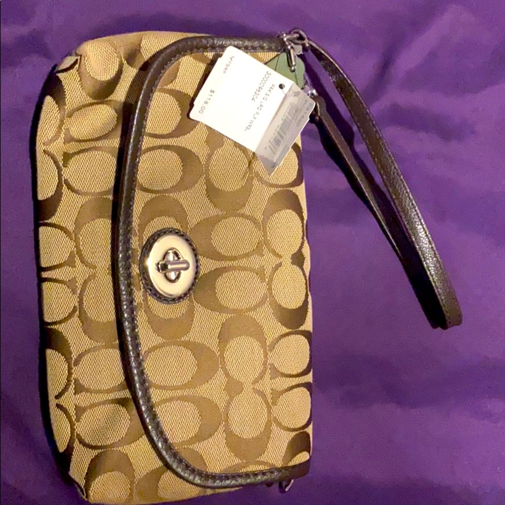 Coach signature large flip wristlet